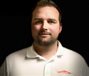 male employee in dark background profile picture